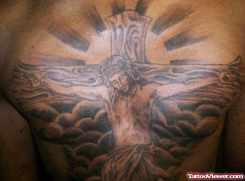 Grey Ink Cross And Jesus Tattoo On Chest