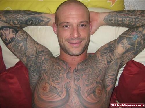 Grey Ink Tattoo On Men Chest And Sleeves