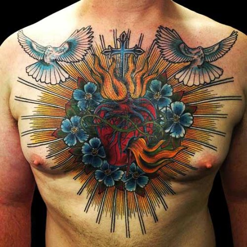 Colored Heart With Cross In Flames And Flying Dove Chest Tattoo