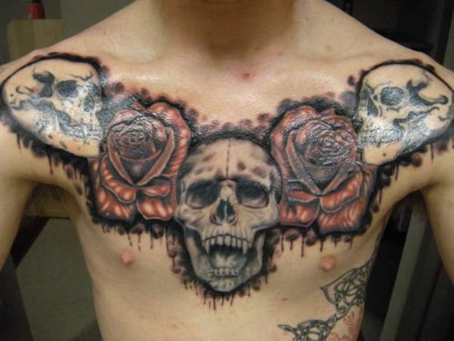 Rose Flowers And Skulls Chest Tattoo