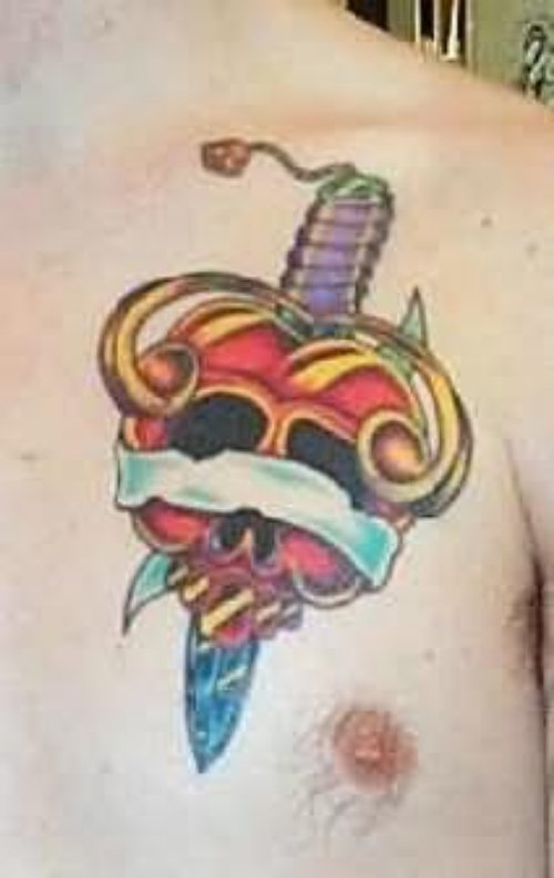 Skull And Knife Tattoo On Chest