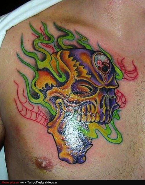 Flaming Skull Colored Ink Chest Tattoo