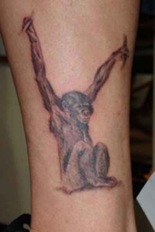 Grey Ink Chimpanzee Tattoo On Arm