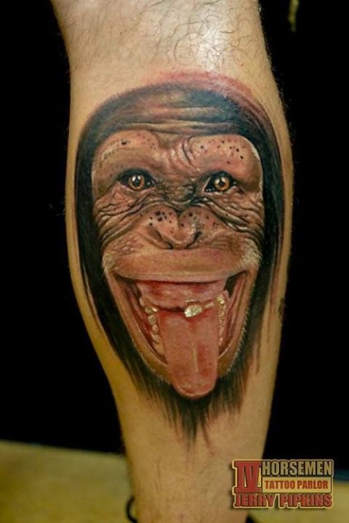 Colored Funny Chimpanzee Tattoo On Back Leg