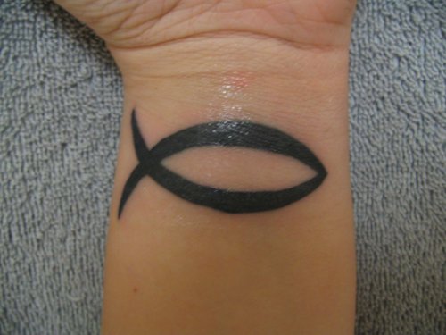 Black Ink Jesus Fish Christian Tattoo On Left Wrist