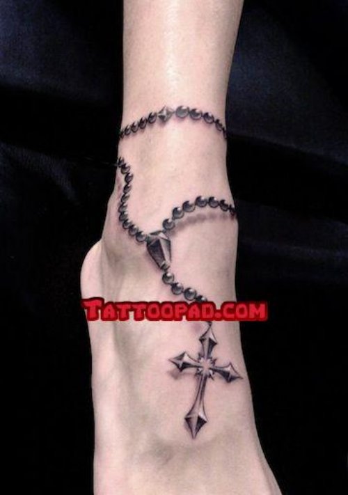 Grey Ink Cross And Rosary Tattoo On Right Foot