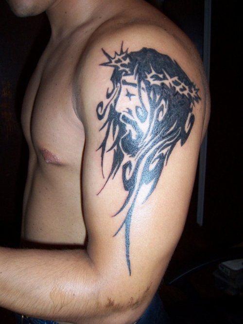 Black Tribal Jesus Head Christianity Tattoo On Left Shoulder
