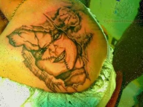 Chucky Head Tattoo On Back Shoulder