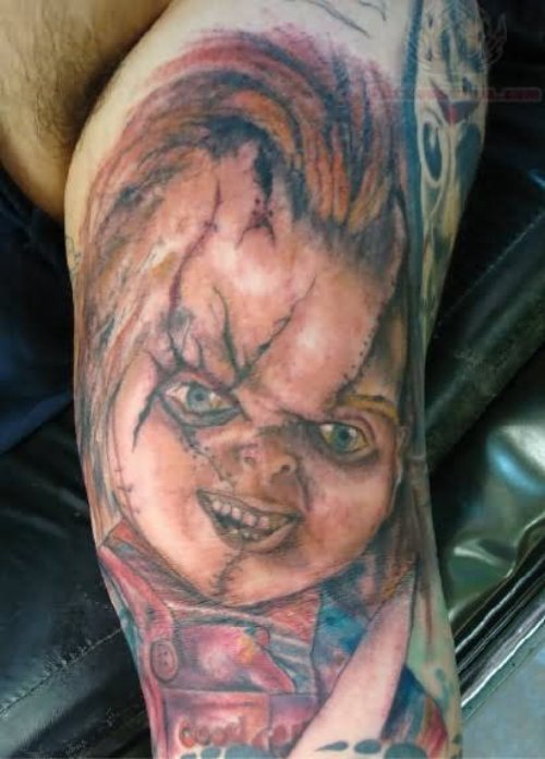 Color Chucky Tattoo On Muscles