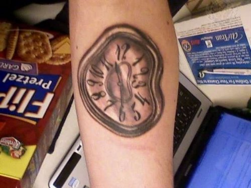 Dali Clock Tattoo On Arm