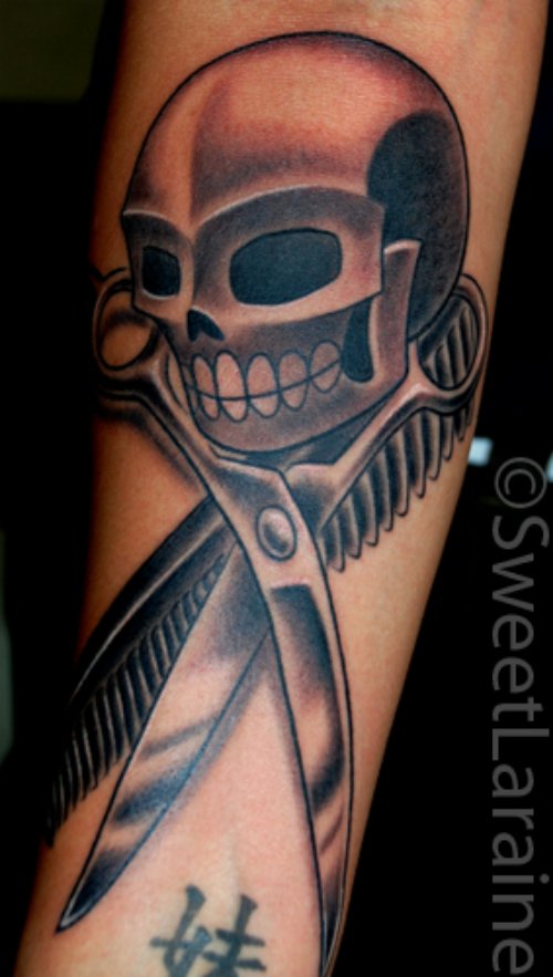 Grey Ink Skull With Comb And Scissor Tattoo On Arm