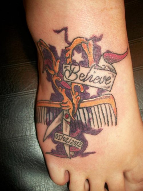 Scissor And Comb with Believe Banner Tattoo On Right Foot