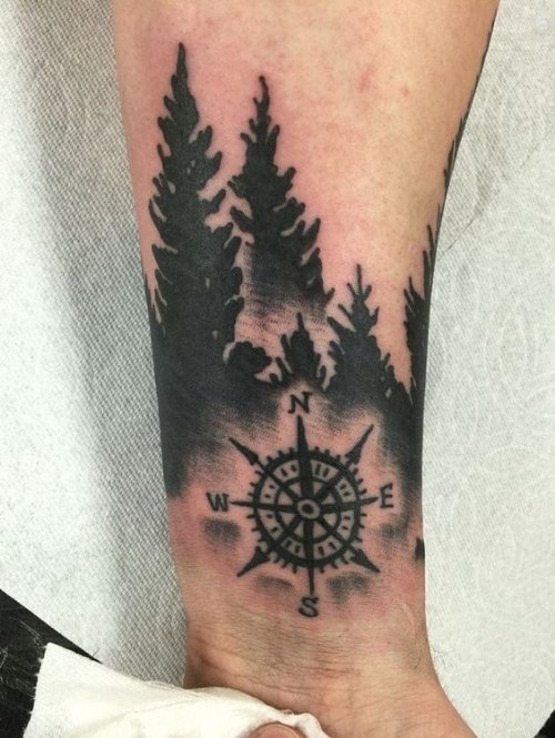 Black Trees And Compass Tattoo On Forearm