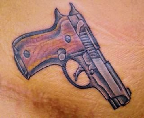 Gun Tattoo on Belly