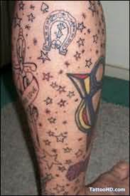 Stars And Horse shoe Tattoo On Leg