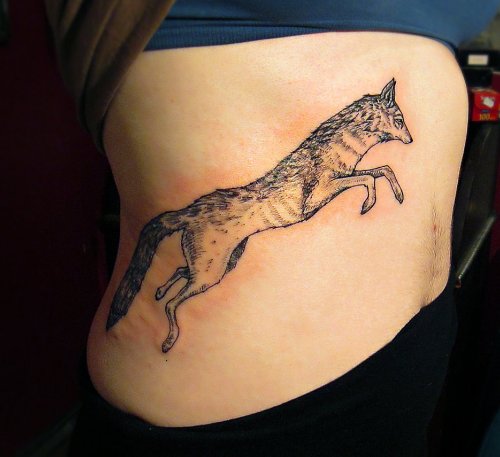 Running Coyote Tattoo On Girl Rib Side