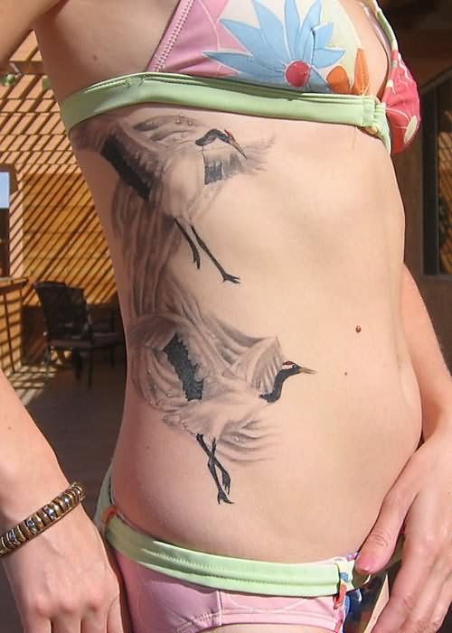 Grey Ink Crane Tattoo On Rib Side