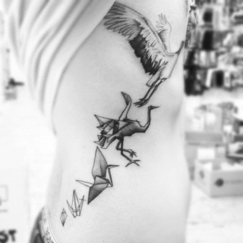 Grey Ink Rib Side Crane Tattoo