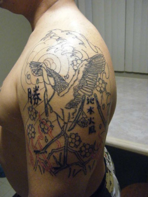 Grey Ink Crane Tattoo On Man Left Shoulder