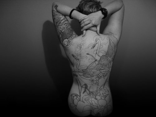 Girl With Crane Tattoo On Back