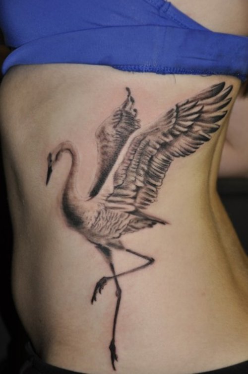 Grey Ink Dancing Crane Tattoo On Rib Side