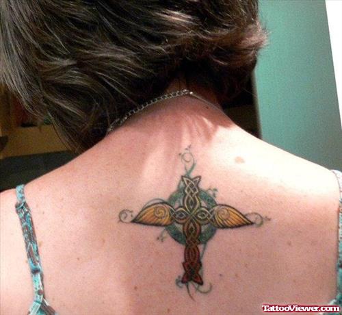 Winged Celtic Cross Tattoo On Girl Upperback