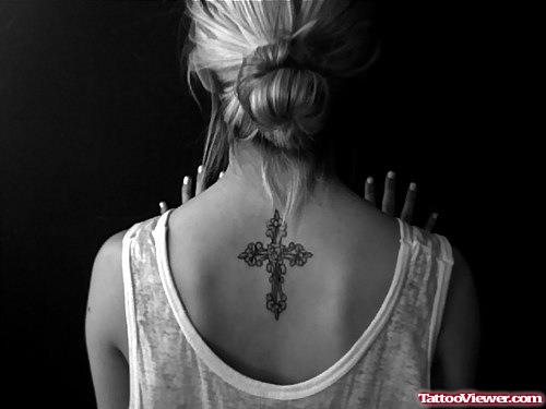 Girl With Cross Tattoo On Upperback