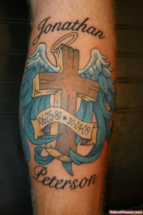 Memorial Cross And Blue Wings Tattoo