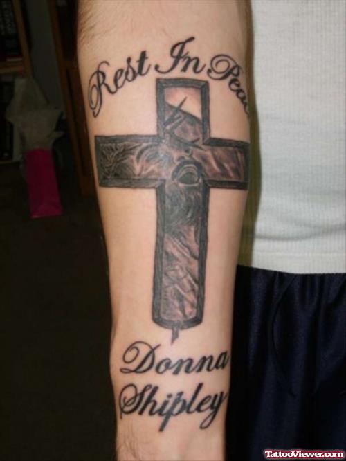 Rest In Peace Cross Tattoo On Right Arm