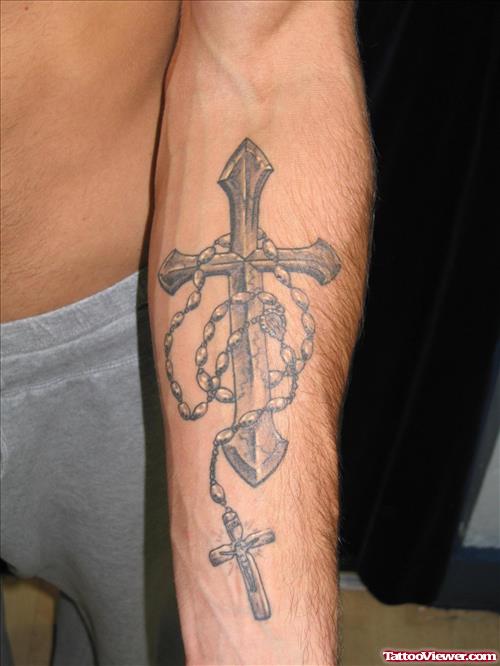 Grey Ink Cross Tattoos On Left Arm