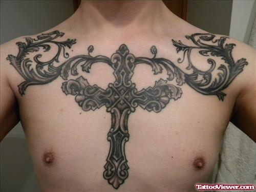 Grey Ink Cross Man Chest Tattoo