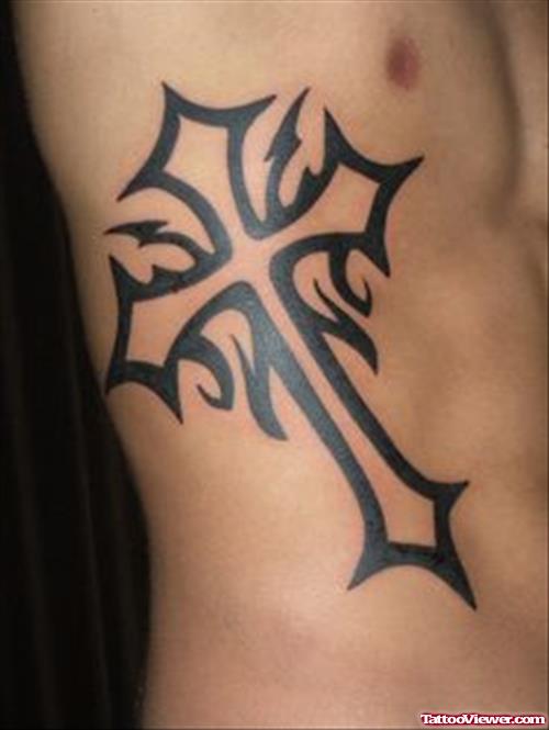 Black Ink Tribal Cross Tattoo On Side Rib