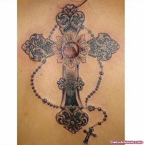 Grey Ink Cross And Rosary Tattoo