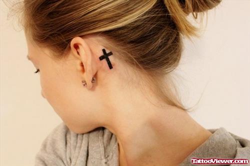 Small Black Cross Tattoo On Back Ear
