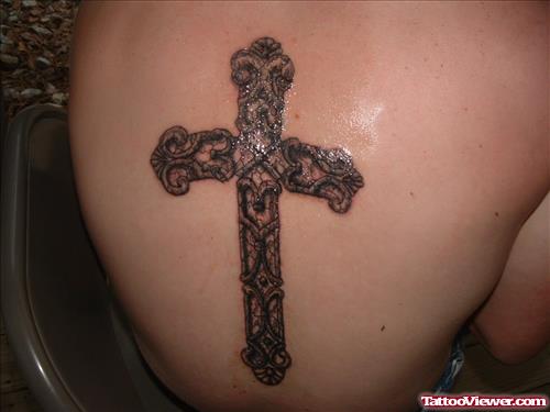 Grey Ink Cross Tattoo On Back Body