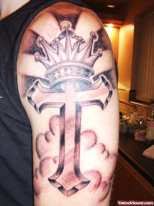 Grey Ink Cross With Crown Tattoo On Half Sleeve