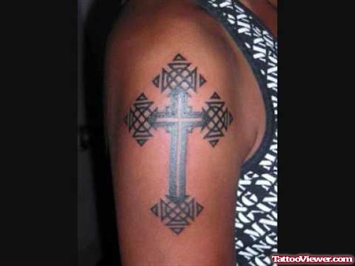 Awesome Black Cross Tattoo On Right Shoulder