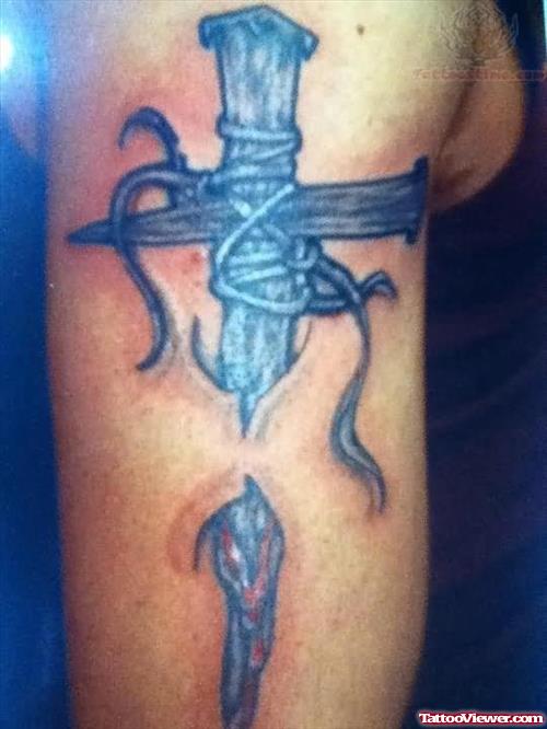 cross under skin tattoo