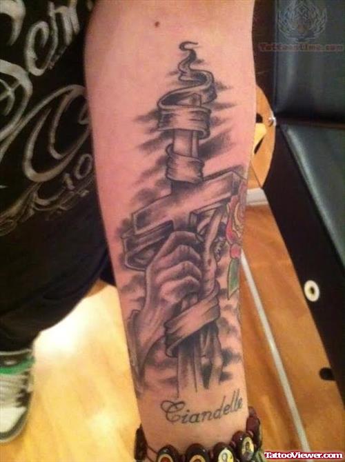 Ciandelle Cross Tattoo On Arm
