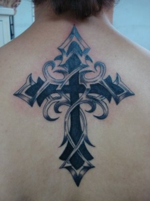 Black Ink Tribal Cross Tattoo On Man Upperback