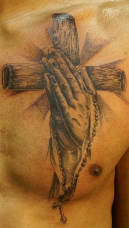 Grey Ink Praying Hands And Cross Tattoo On Man Chest