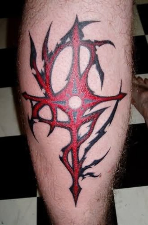 Red Tribal Cross Tattoo On Back Leg