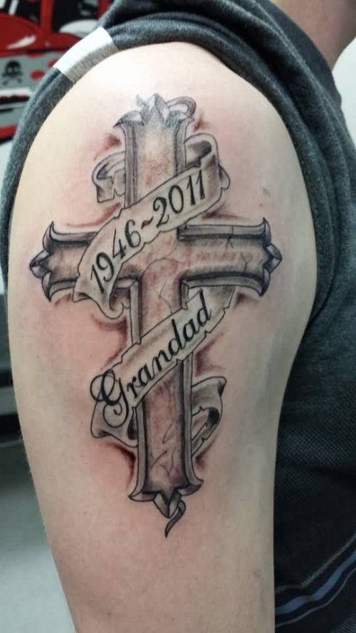 Grey Ink Cross Tattoo On Right Biceps