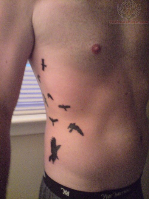 Flying Crow Tattoos On Side Rib