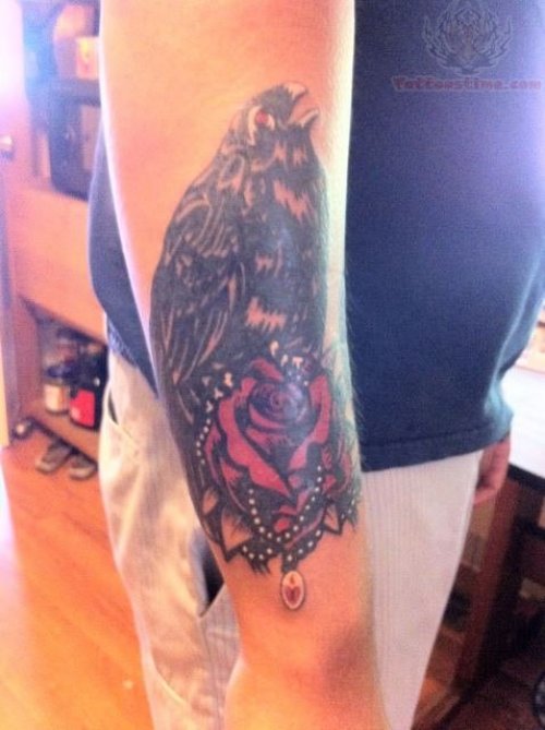 Red Rose And  Crow Tattoo On Arm