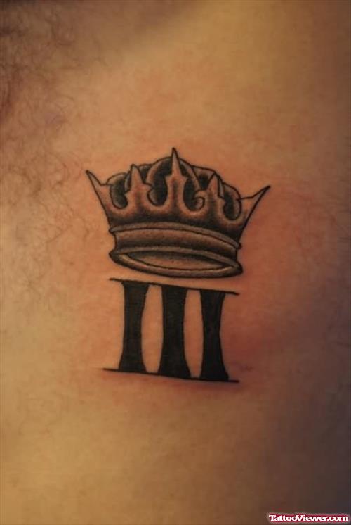 Tiny Crown Symbol Tattoo