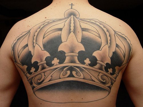 Black And Grey Crown Tattoo On Man Upperback
