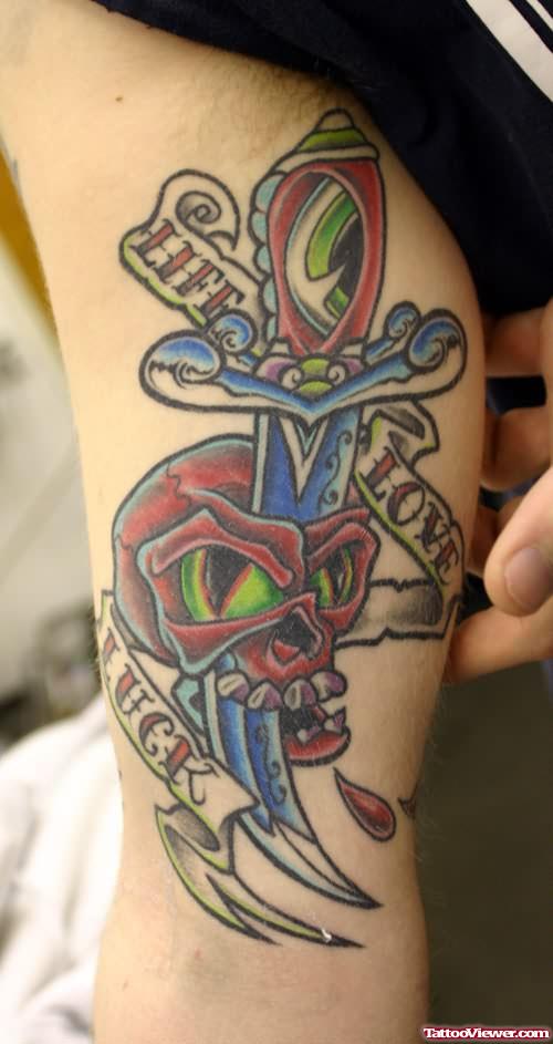 Skull And Dagger Tattoo On Biceps