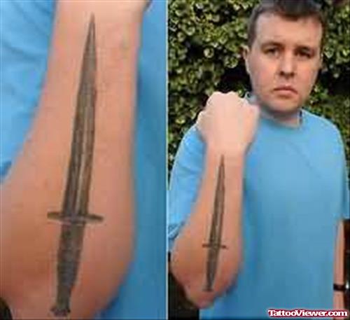 Simple Dagger Tattoo On Arm