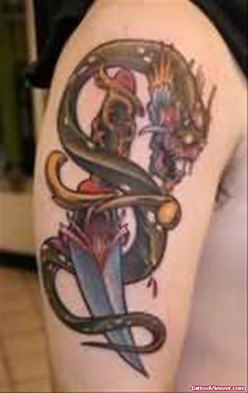 Snake And Knife Tattoo On Shoulder